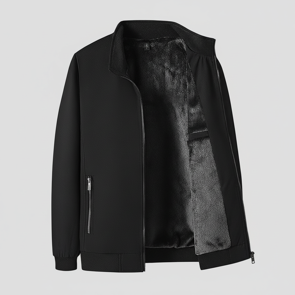 Black jacket with gray lining displayed against a snowy forest background